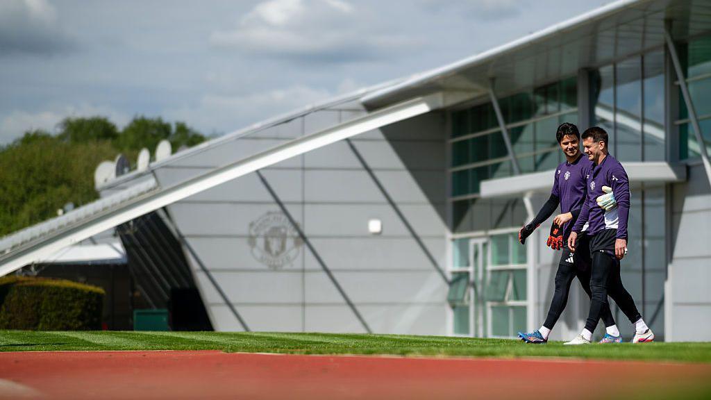 Senne Lammens and Tom Heaton of Manchester United in action during a first team training session