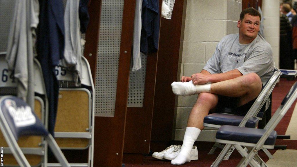 Ryan O'Callaghan in the locker room at a Patriots rookie training camp in 2006