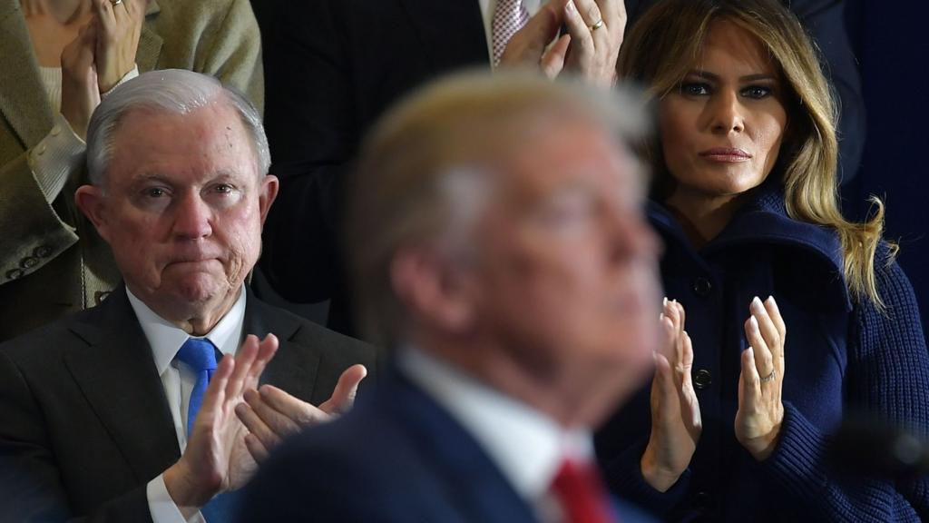 In this file photo taken on March 19, 2018 Attorney General Jeff Sessions (L) and First Lady Melania Trump applaud as US President Donald Trump speaks about combating the opioid crisis at Manchester Community College in Manchester, New Hampshire