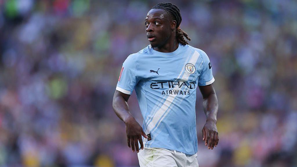 Jeremy Doku playing for Manchester City