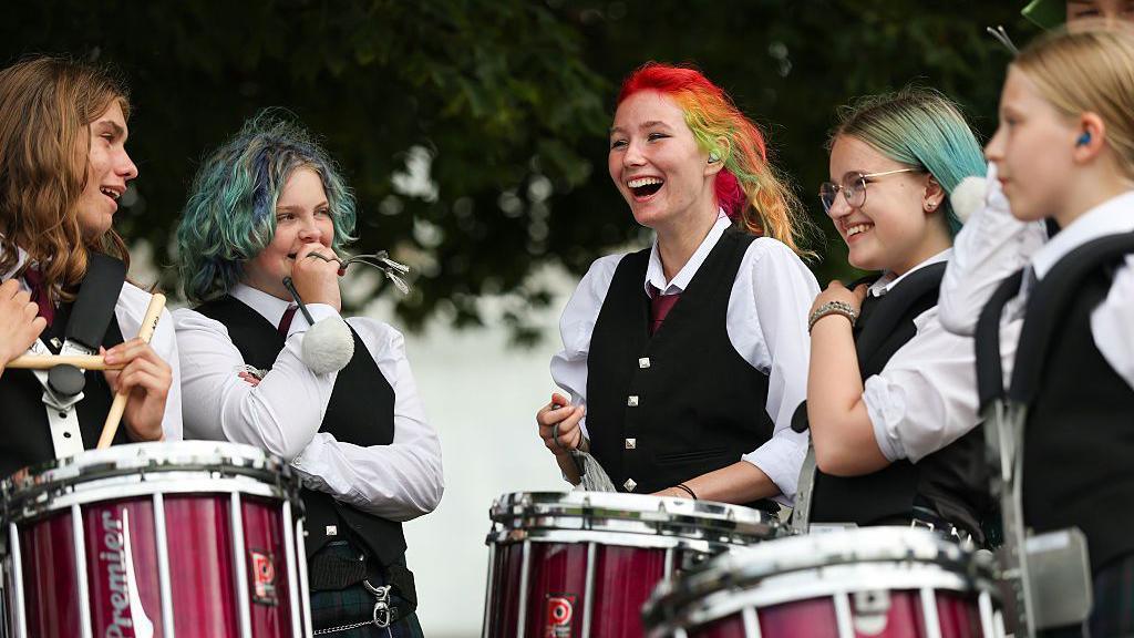 A group prepare to compete in World Pipe Band Championship
