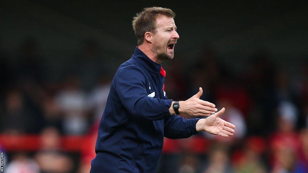 Cheltenham head coach Wade Elliott shouts at his team from the touchline