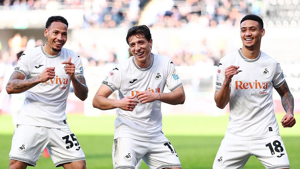 Goncalo Franco celebrates his goal with Ronald and Gustavo Nunes 