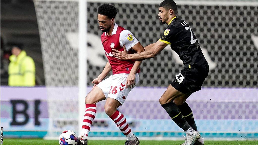 Zak Vyner of Bristol City and Ashley Fletcher of Wigan