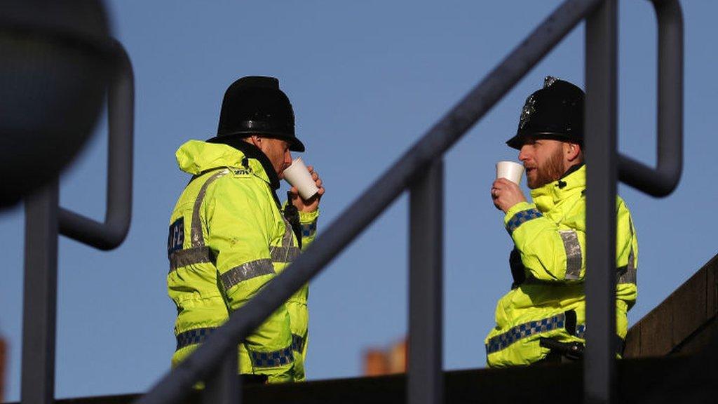 Policemen enjoying a coffee