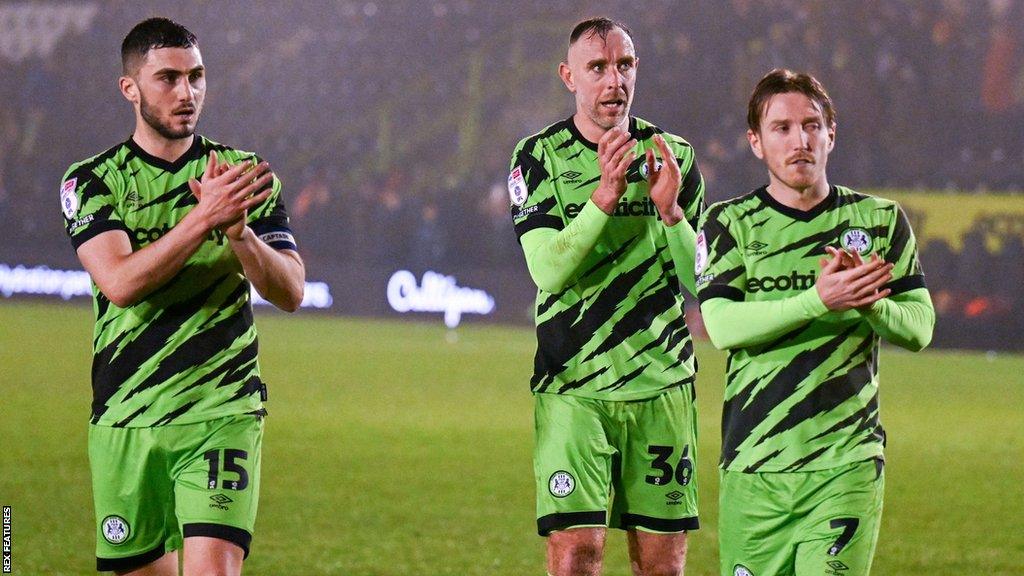 Forest Green players clap towards fans at the end of their draw with Wrexham