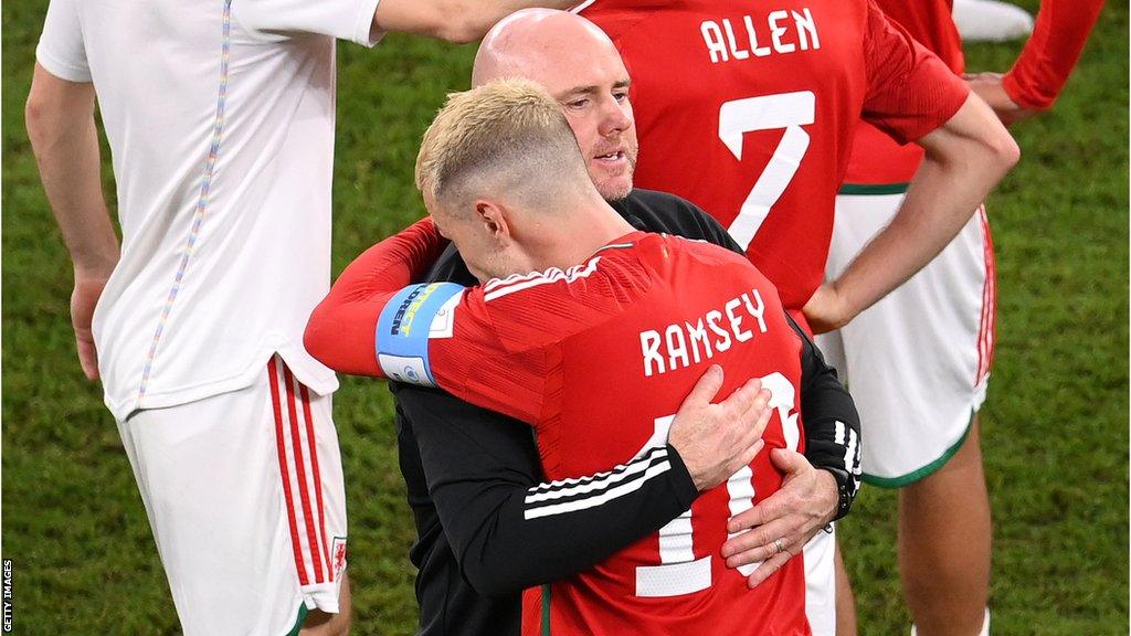 Rob Page and Aaron Ramsey hug