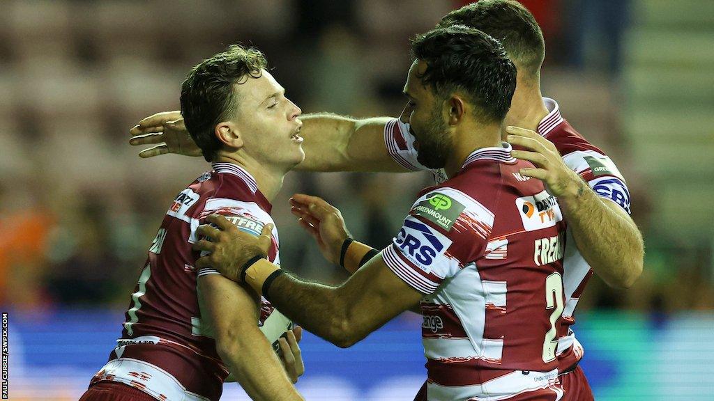 Jai Field celebrates Wigan's fourth try with fellow Aussie Bevan French