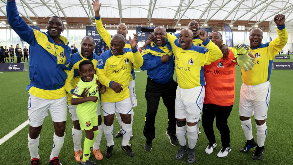 Pele's Pearls football players celebrate after winning their FA People's Cup category