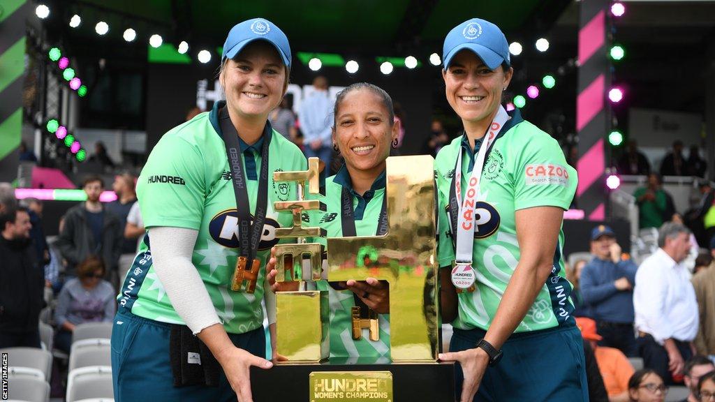 Left to right: Dane van Niekerk, Shabnim Ismail and Marizanne Kapp celebrate winning The Hundred with Oval Invincibles