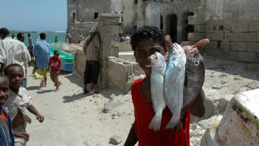 Somali boy with fish