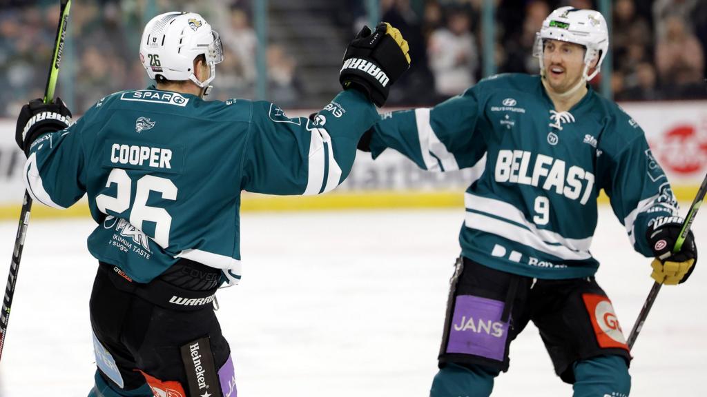 Belfast Giants Mark Cooper celebrates scoring