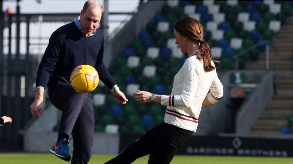 Prince William and Kate play football with children