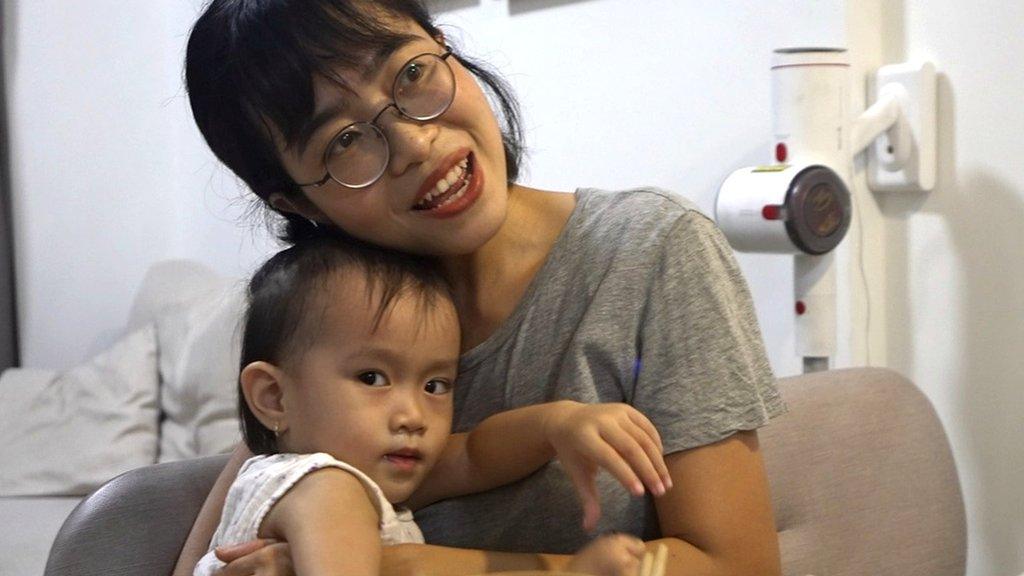 Tran Nguyen Kim Ngan with her toddler