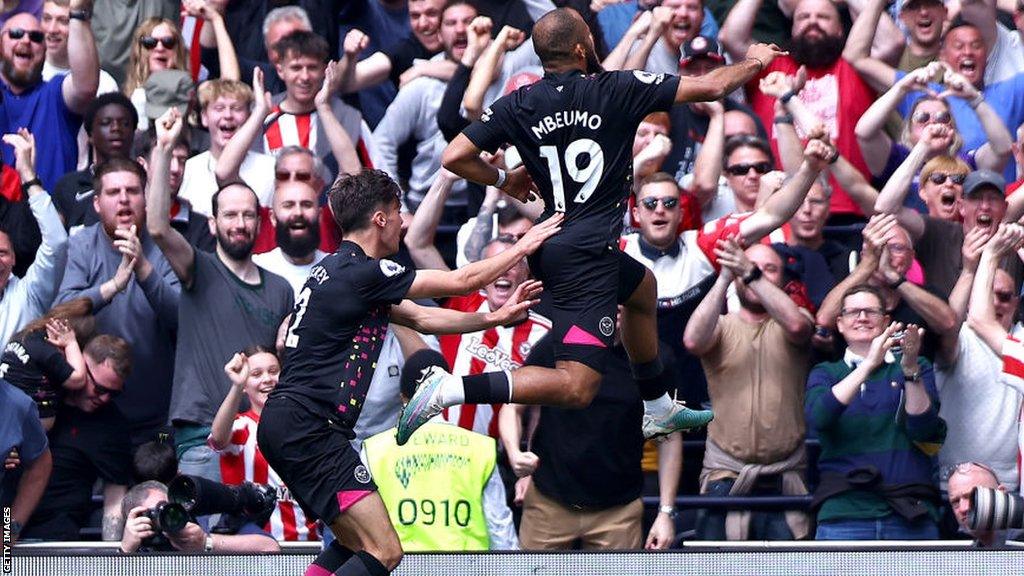 Bryan Mbeumo celebrates in front of the Brentford fans