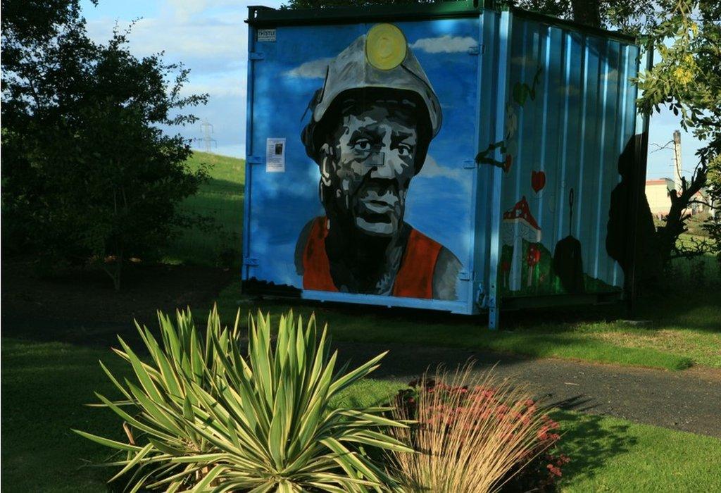 mural of miner in the grounds of the miners memorial garden Ballingry, Fife.