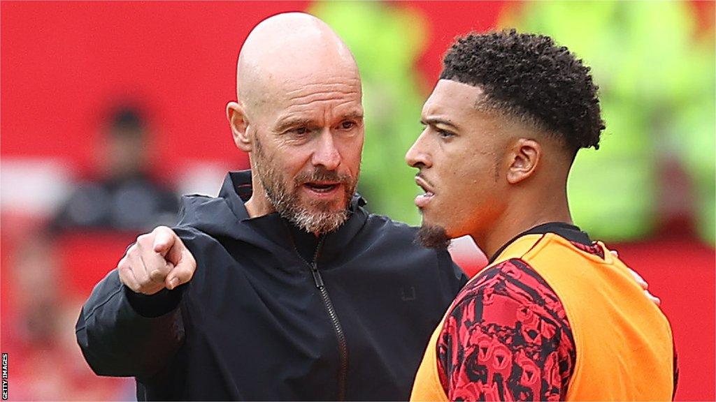 Jadon Sancho talks with Erik ten Hag