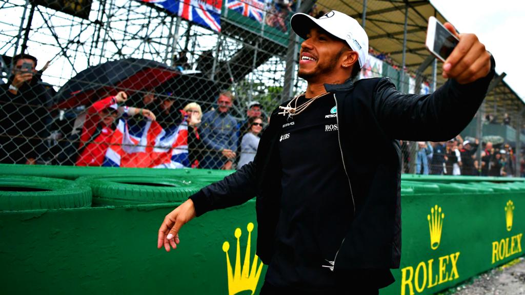 Lewis Hamilton greets fans at Silverstone