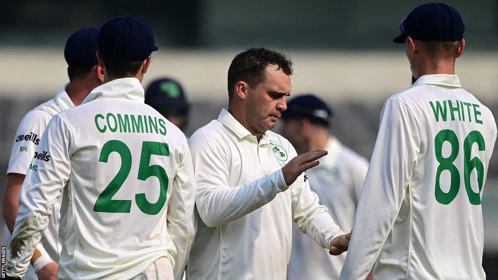 Andy McBrine is congratulated by team-mate Ben White dismissing Bangladesh's century-maker Mushfiqur Rahim