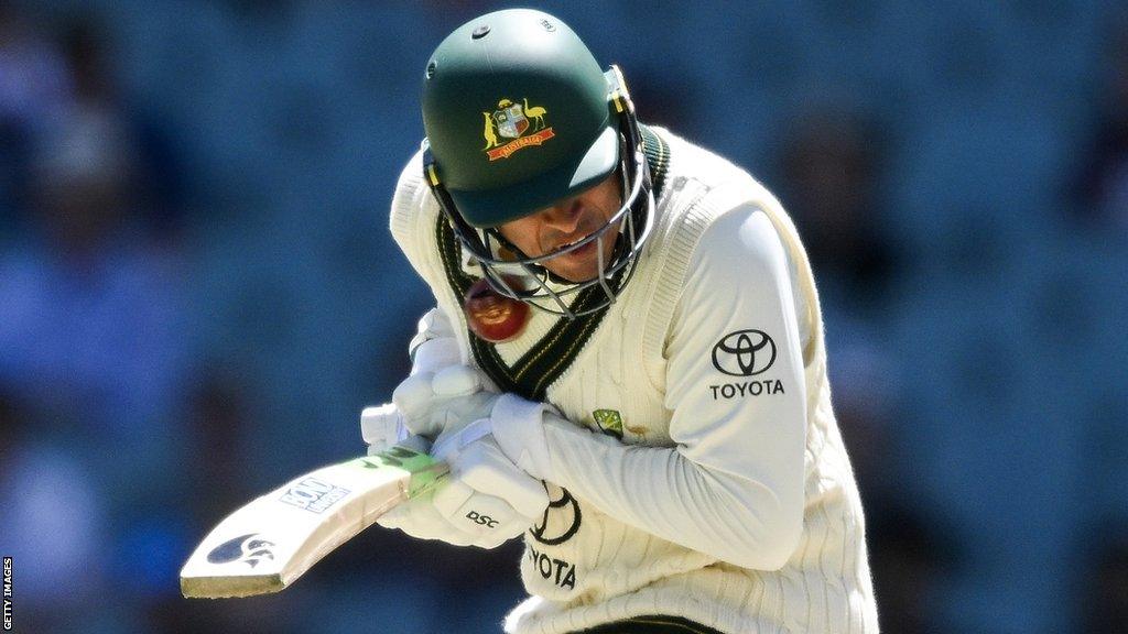 Australia opener Usman Khawaja is hit by a bouncer by West Indies' Shamar Joseph