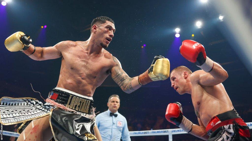 Jai Opetaia throws a right hand at Mairis Briedis during their world title fight in July 2022