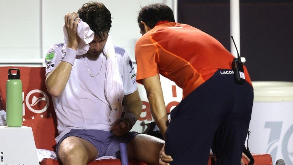 Cameron Norrie receives medical attention during his Rio Open semi-final defeat