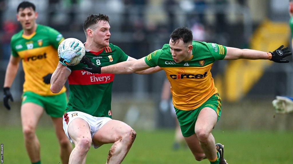 Mayo's Matthew Ruane attempts to skip past Donegal's Caolam McColgan at Ballybofey