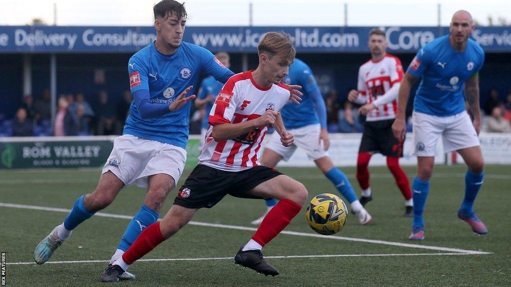 Jacob Lambert of Sheppey United shields the ball