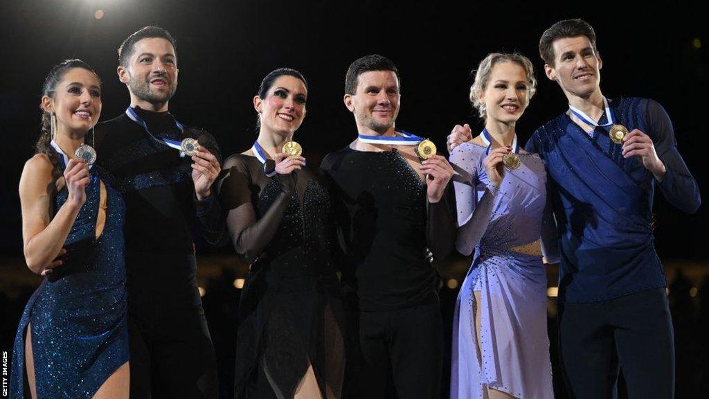 Second placed Britain's Lilah Fear and Lewis Gibson, winner Italy's Charlene Guignard and Marco Fabbri and third placed Finland's Juulia Turkkila and Matthias Versluis celebrate on the podium