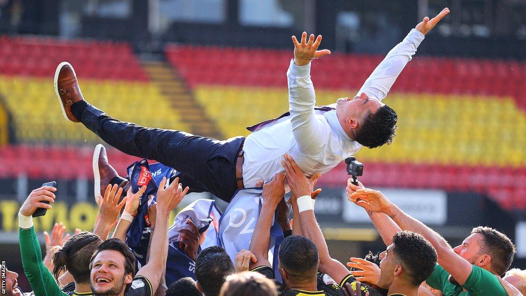 Xisco Munoz is tossed into the air by his jubilant Watford team after achieving promotion