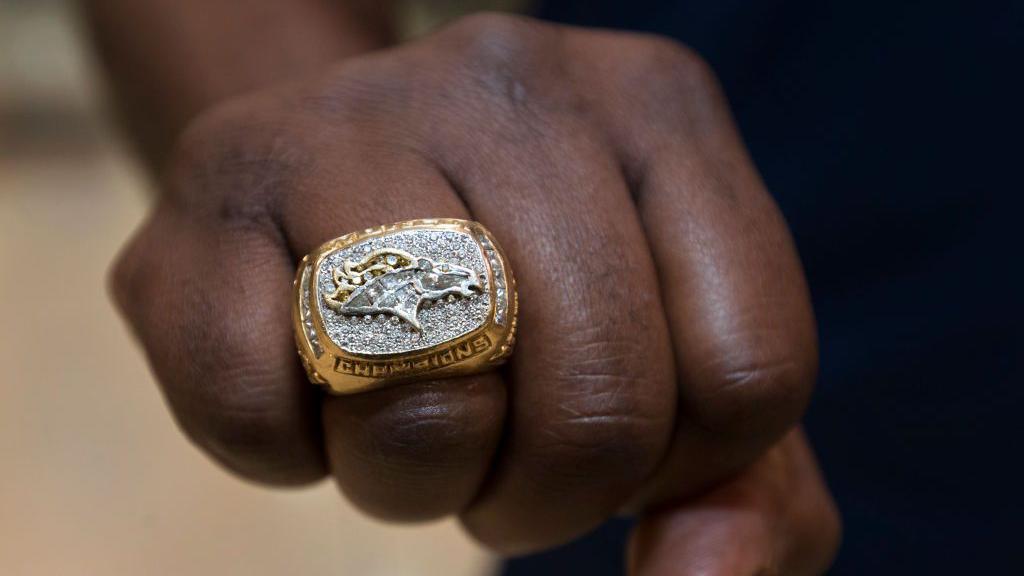 Allen Aldridge shows off his 1998 Super Bowl ring