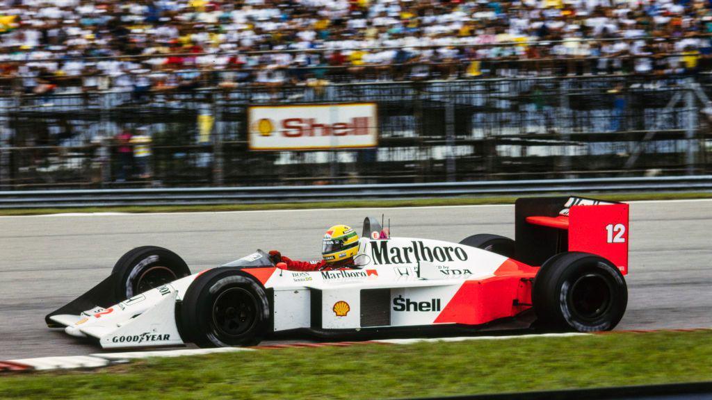 A side view of Ayrton Senna driving the McLaren MP4/4 during the 1988 Brazilian Grand Prix