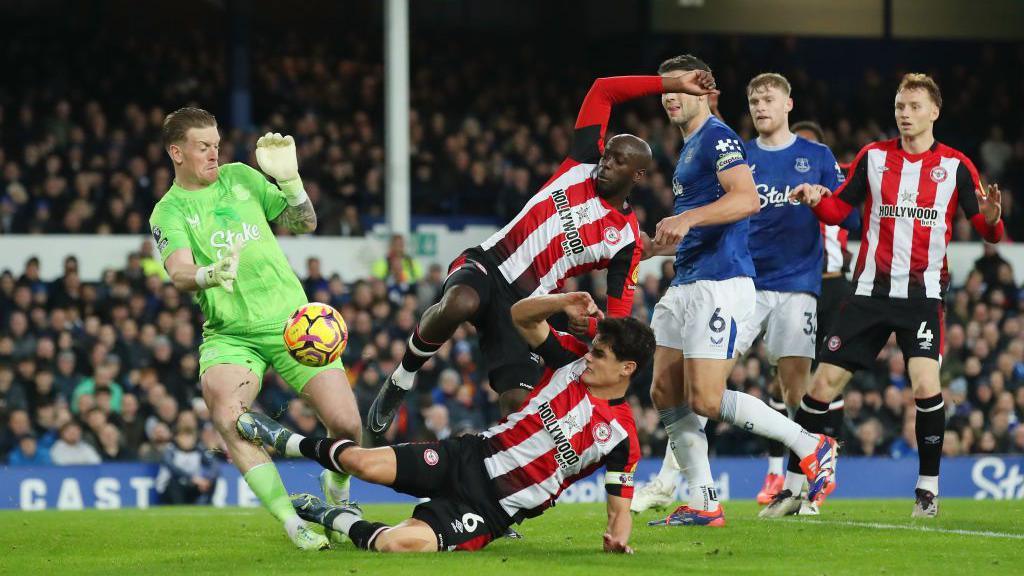 Jordan Pickford of Everton is fouled by Christian Norgaard of Brentford leading to a red card