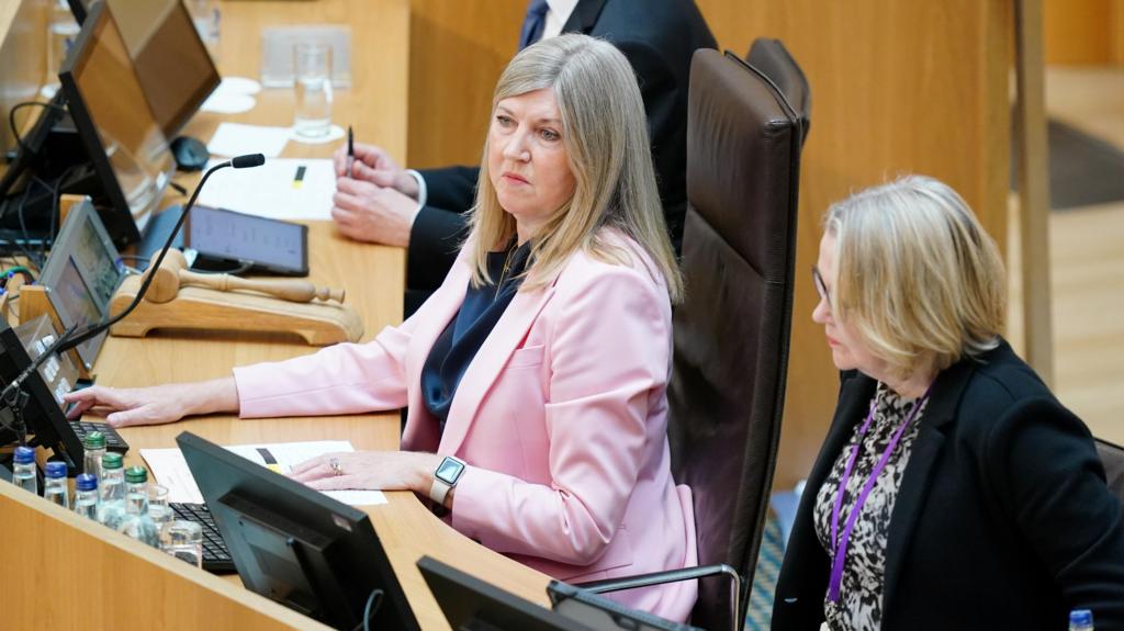 presiding officer at her desk