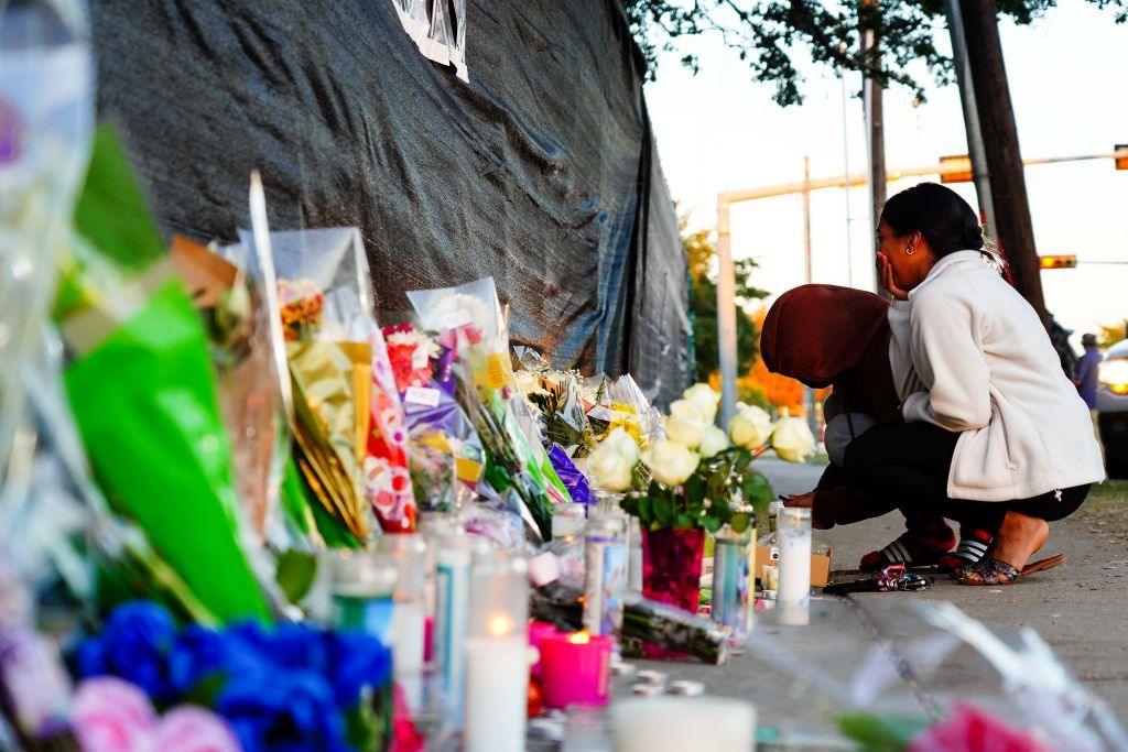 Families mourn outside the gates of the Astroworld festival in 2021