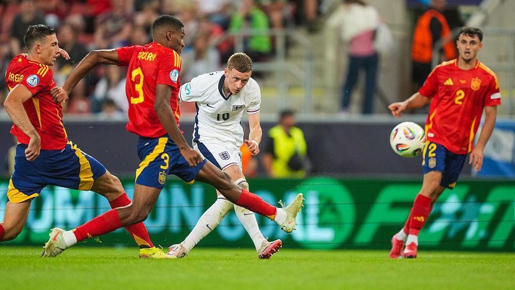 Jay Stansfield has a shot at goal against Spain