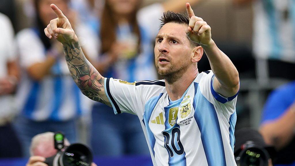 Lionel Messi of Argentina celebrates after scoring his team's first goal during their World Cup game against Austria