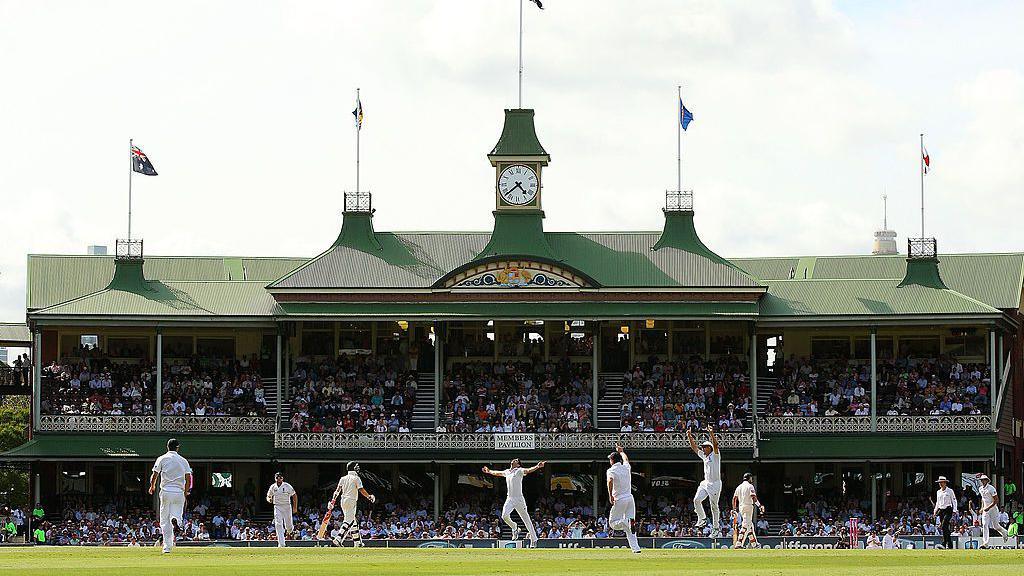 England's James Anderson celebrates taking a wicket in front of the Sydney Cricket Ground pavilion