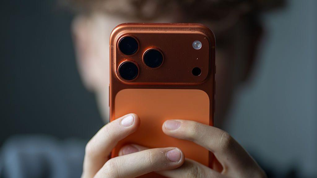 A child with an iPhone