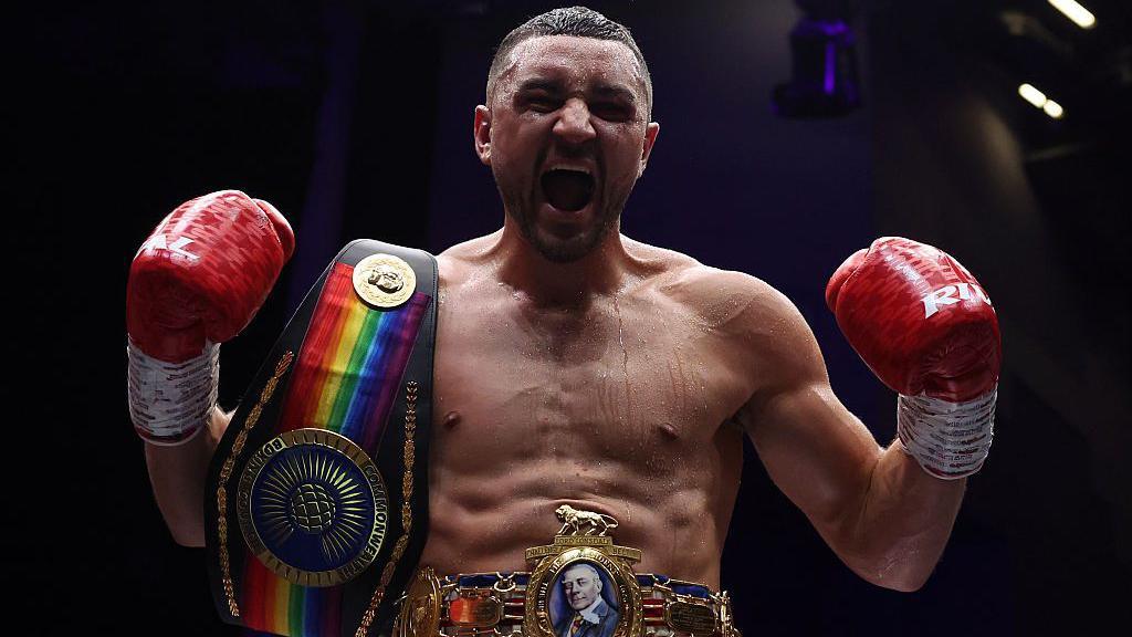 Callum Simpson celebrates with the British and Commonwealth super-middleweight belts after winning his rematch with Troy Williamson