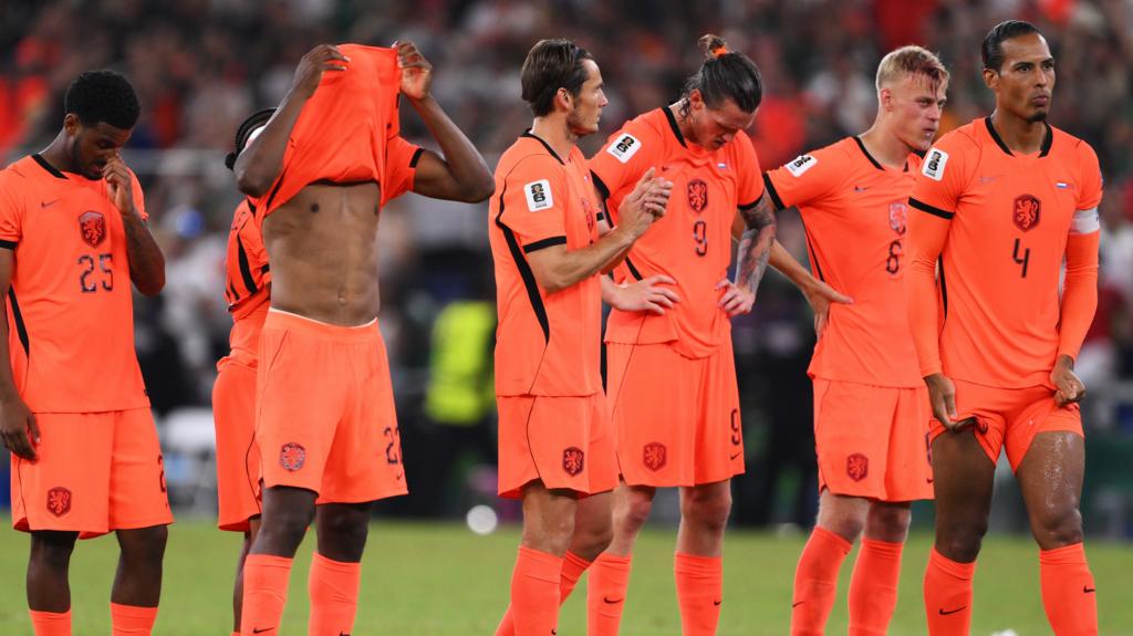 Netherlands players including Virgil van Dijk look dejected after Morocco won the penalty shootout