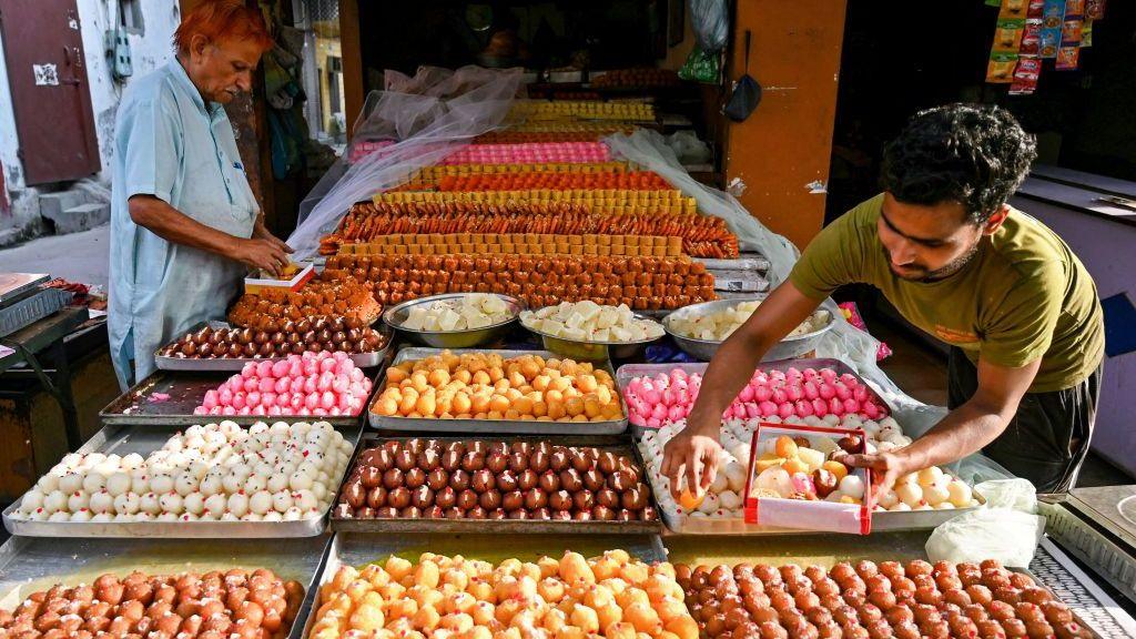 An image of a sweetmeats shop in northern India showing a wide array of desserts