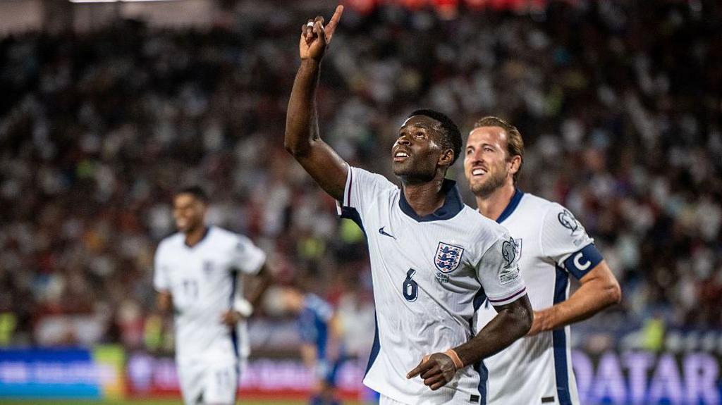 Marc Guehi and Harry Kane celebrating