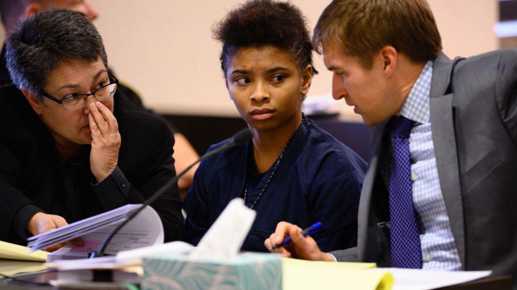 Chrystul Kizer sits with her lawyers during a hearing in the Kenosha County Courthouse on 15 November 2019