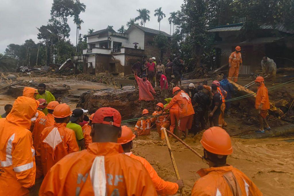 This handout photograph taken on July 30, 2024 and released by India's National Disaster Response Force (NDRF) shows NDRF personnel at the disaster site as they rescue victims of the landslide in Wayanad.