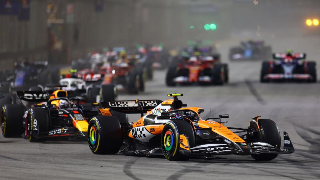 Lando Norris leads Max Verstappen and the rest of the field at the start of the Singapore Grand Prix