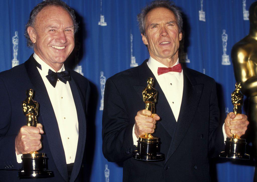 Gene Hackman and Clint Eastwood holding their Oscars for Unforgiven