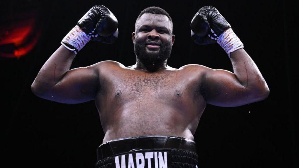 Martin Bakole holds up his fists