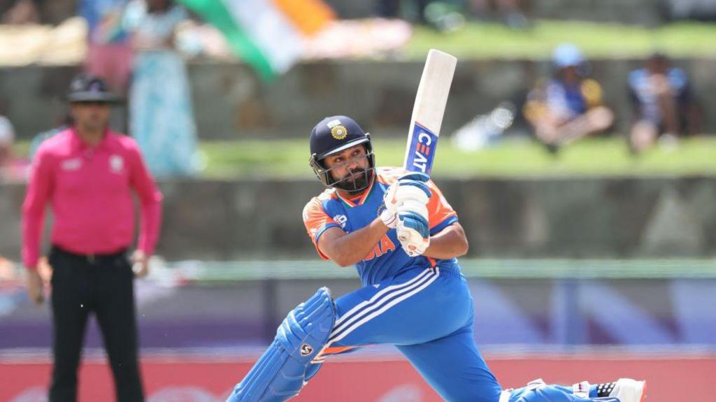 Rohit Sharma of India hits a four as he bats during the ICC Men's T20 Cricket World Cup West Indies & USA 2024 Super Eight match between India and Bangladesh at Sir Vivian Richards Stadium on June 22, 2024 in Antigua, Antigua and Barbuda. (