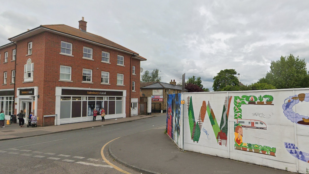 Junction of West St Rochford, showing a Sainsbury's Local supermarket and part of a giant West St sign